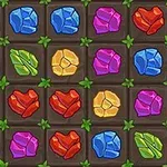 Kolorowe klejnoty w różnych kształtach i barwach, ułożone w siatce na ciemnym tle