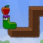 Zielona postać o kształcie litery L z jabłkiem na głowie stoi na brązowej ścieżce z zakrętem i patrzy na czarny krążek po prawej stronie