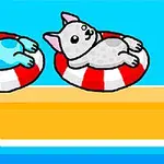 Dwa kolorowe koty leżące na czerwono-białych kołach na tle turkusowego nieba i żółtej plaży