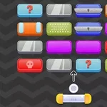 Kolorowe prostokątne bloki z różnymi symbolami, takie jak czaszki i znaki zapytania, ułożone w rzędach na tle w jodełkę