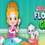 Dziewczynka w różowej sukience patrząca w lustro z białym kotkiem siedzącym obok, na tle zielonej ściany