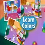 Dziecko w różowej czapce trzyma kolorowy obrazek, otoczone kolorowymi tablicami i zabawkami, z napisem Learn Colors na środku