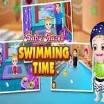 Dziecko w kostiumie kąpielowym obok basenu z napisem Baby Hazel Swimming Time