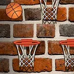 Ceglana ściana z trzema obręczami do koszykówki i piłką