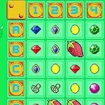 Siatka z kolorowymi ikonami przedstawiającymi klejnoty, owoce i fantastyczne stworzenia