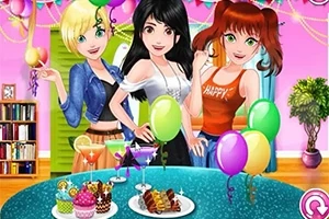 Trzy dziewczyny ubrane w kolorowe stroje na przyjęciu z balonami i deserami na stole