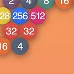 Kolorowe kulki z liczbami na pomarańczowym tle