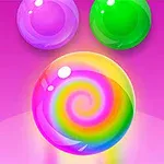 Trzy kolorowe, błyszczące kulki na różowym tle, z główną kulką w środku zawierającą tęczowy wir