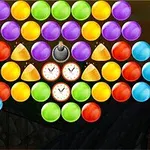 Kolorowe kulki ułożone w rzędach z bombą i zegarami pomiędzy nimi