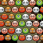 Różnokolorowe emotikony z różnymi wyrazami twarzy ustawione w rzędach na ciemnym tle