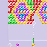 Kolorowe kule ułożone w układzie na planszy z wyrzutnią kul na dole pośrodku