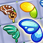 Kolorowe symbole przypominające skrzydła motyla na kafelkach, z jednym podkreślonym żółtą gwiazdką