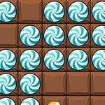 Plansza z czekoladowymi kostkami i niebiesko-białymi cukierkami