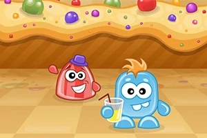 Dwie kolorowe animowane postacie w tym czerwony stworek z fioletowym kapeluszem i niebieski stworek z blond włosami trzymający napój, na tle cukierkowej ściany