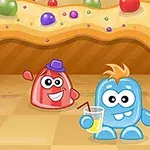 Dwie kolorowe animowane postacie w tym czerwony stworek z fioletowym kapeluszem i niebieski stworek z blond włosami trzymający napój, na tle cukierkowej ściany