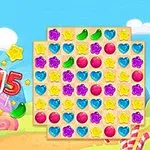 Kolorowa plansza z układem cukierkowych kształtów, takich jak serca, gwiazdy i kulki, na tle krajobrazu pełnego tęcz i chmur