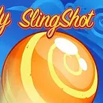 Kolorowa grafika przedstawiająca dużego, pomarańczowego cukierka na tle nieba z chmurami i napisem Candy SlingShot