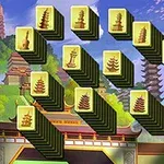 Klocki z orientalnymi symbolami ustawione w tle azjatyckiego krajobrazu z pagodami i drzewami sakura