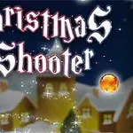 Świąteczna grafika z napisem Christmas Shooter, przedstawiająca kuliste, kolorowe ozdoby na tle ośnieżonego miasteczka