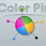 Kolorowe koło podzielone na cztery sektory z różnobarwnymi szpilkami wokół, na szarym tle