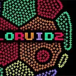 Kolorowy, pikselowy napis COLORUID 2 otoczony geometrycznymi wzorami w różnych kolorach na czarnym tle