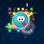 Świecąca niebieska kulka z twarzą w centrum otoczona kolorowymi dyskami i iskrami na ciemnym tle