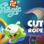 Zielony stworek z dużymi oczami wpatruje się w swoje odbicie w lustrze, a w tle unoszą się kolorowe cukierki i napis Magic