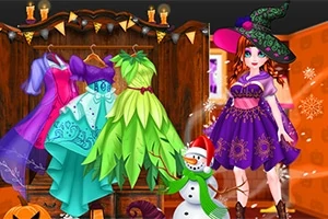 Kobieta w stroju czarownicy stoi obok manekinów z kolorowymi sukienkami w pomieszczeniu udekorowanym na Halloween