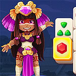 Postać ubrana w kolorowy strój z piórami stoi obok kafelków z kolorowymi symbolami, takimi jak klejnoty, motyl i liść