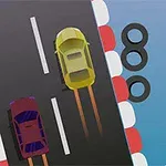 Dwa samochody ścigają się na torze otoczonym oponami z czerwono-białymi barierkami