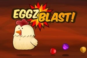 Kurczak obok kolorowych kulek oraz napis Eggz Blast!