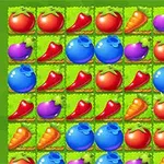 Kolorowe warzywa i owoce ułożone w rzędach na zielonym tle, w tym pomidory, marchewki, jagody i papryki