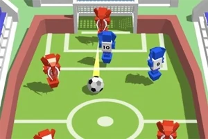 Niebieskie i czerwone figurki na prostokątnym boisku w kolorach trawy próbują strzelić gola, z piłką zmierzającą w stronę bramki