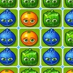 Kolorowe owoce i warzywa z oczami ułożone w układzie siatki na zielonym tle