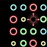 Kolorowe, świecące okręgi ułożone symetrycznie na czarnym tle z celownikiem pośrodku