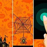 Pomarańczowe tło z motywami Halloween, pająk na pajęczynie oraz ludzki palec dotykający okrągły przycisk na ciemnym tle