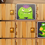 Zielone stworzenia o zabawnych kształtach na tle drewnianych drzwi