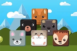 Kostki ze śmiesznymi twarzami zwierząt na tle gór i nieba z chmurami