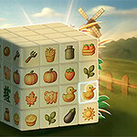 Sześcian z ikonami przedstawiającymi warzywa, owoce i przedmioty gospodarstwa domowego na tle wiejskiego krajobrazu z wiatrakiem