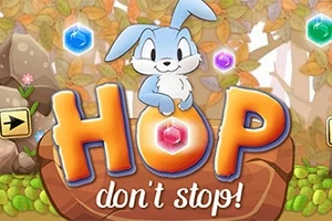 Niebieski królik siedzący na dużym kamieniu z napisem HOP dont stop!