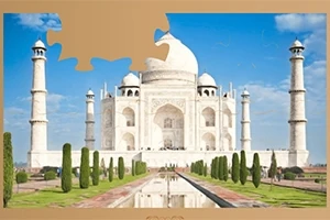 Taj Mahal z niebieskim niebem w tle, z brakującym kawałkiem puzzla w górnym lewym rogu