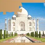 Taj Mahal z niebieskim niebem w tle, z brakującym kawałkiem puzzla w górnym lewym rogu