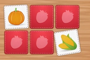 Sześć kwadratowych kart, na dwóch są rysunki dyni i kukurydzy, a cztery są z różowym konturem truskawki na czerwonym tle