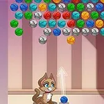 Kot strzelający do kolorowych kulek wewnątrz pomieszczenia