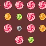 Kolorowe, spiralne cukierki ułożone w rzędach na brązowym tle z kolorową ramką