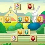 Kolorowe kafelki z pisankami na tle wiosennego krajobrazu z białym królikiem i domem w tle