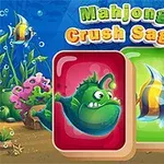 Podwodne tło z kolorowymi rybami i dwoma kartami z rybami, w tym jedna zielona i jedna kolorowa, z napisem Mahjong Crush Saga na górze