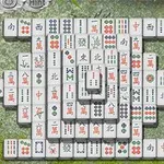 Układ białych płytek z chińskimi znakami i symbolami na kamiennym tle otoczonym zielonymi liśćmi