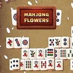 Kolorowe płytki z symbolami układające się w strukturę na tle z kwiatowym obramowaniem i napisem MAHJONG FLOWERS