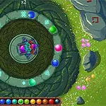 Kolorowe kulki ułożone w kręgu na tle z motywem kamiennym i trawiastym, z centralnie umieszczonymi symbolami i wzorami